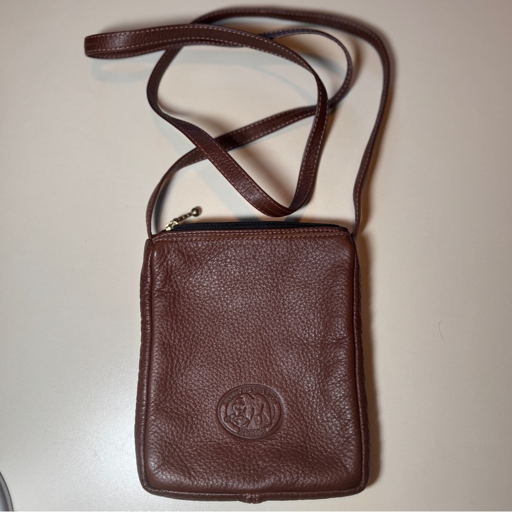 Spirit of the Wild of Canada Leather Crossbody Mini Bag. Eagle/falcon Embossed